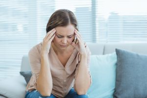 Woman with a chronic headache considering medical botulinum toxin therapy